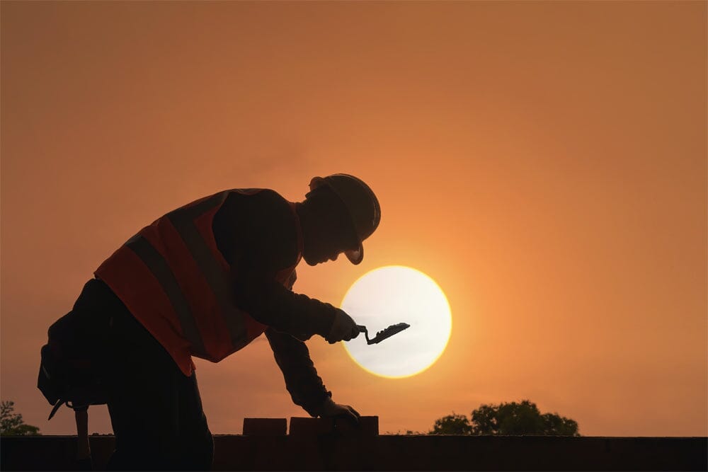 A construction worker working in the sun