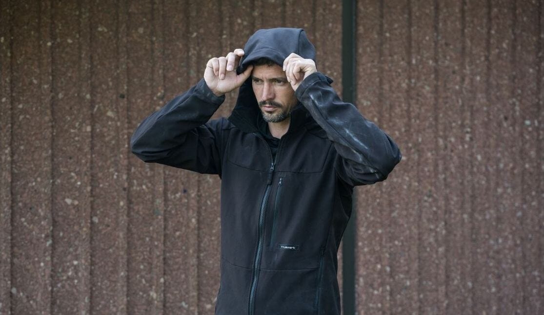 An industrial athlete pulls up the hoody on his Truewerk WerkHoody as the weather gets colder late in the day.